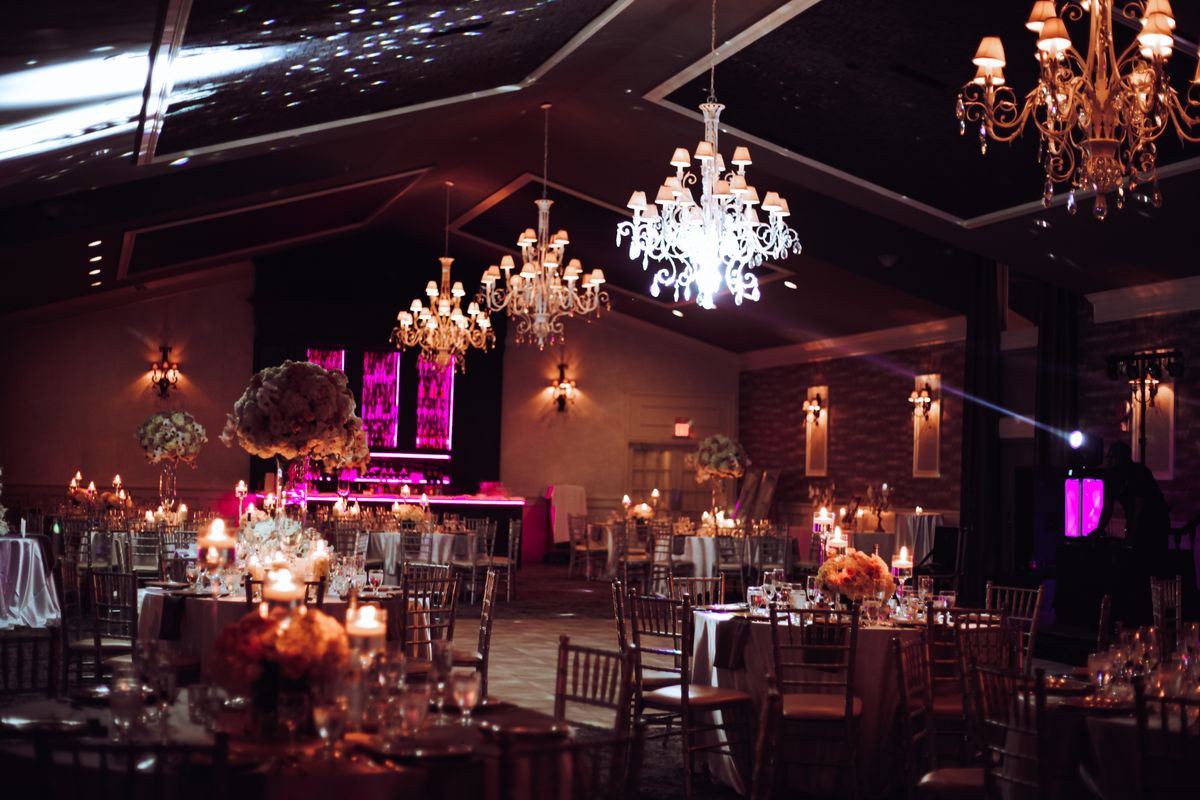 The Ballroom set for a reception beneath crystal chandeliers
