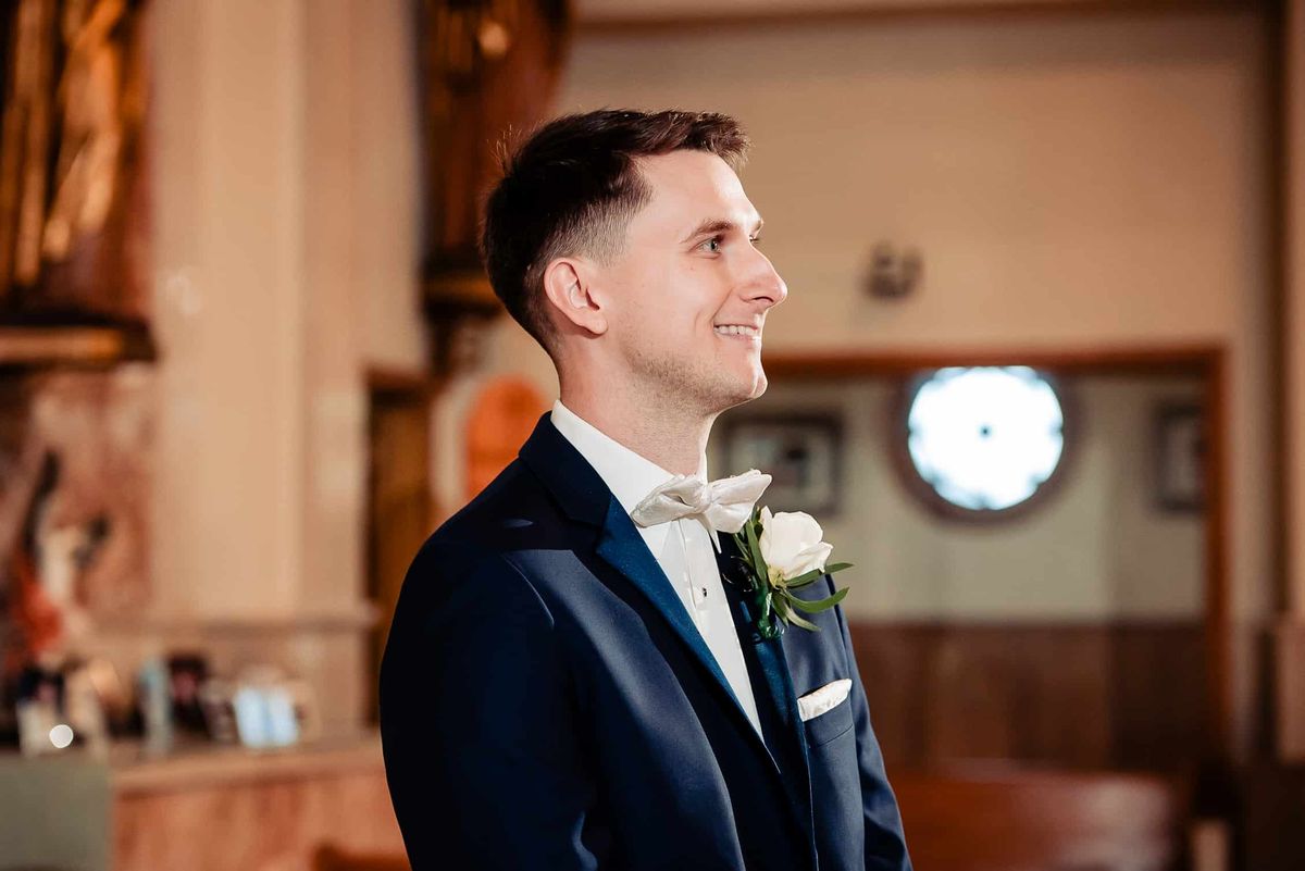 Groom waiting at the altar