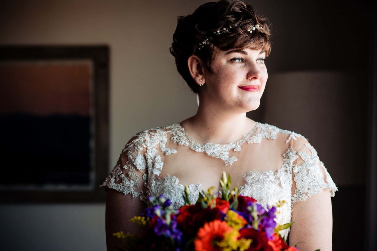 Bride holding a bright autumn bouquet
