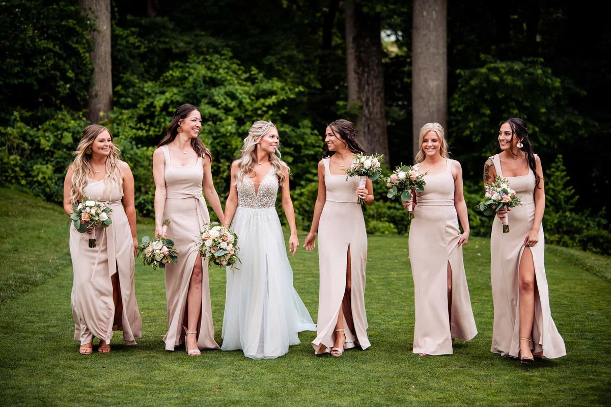 Bride with her bridesmaids in blush gowns